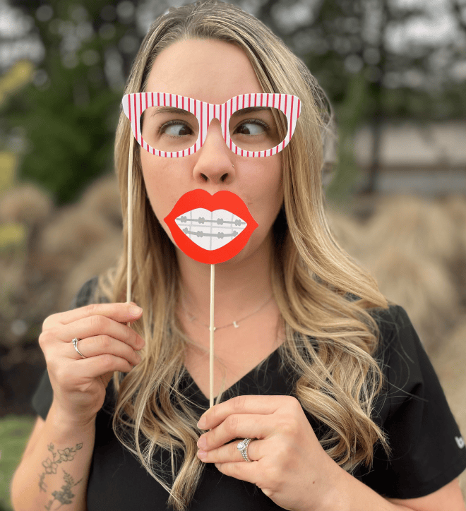 Team member wearing goofy glasses and teeth